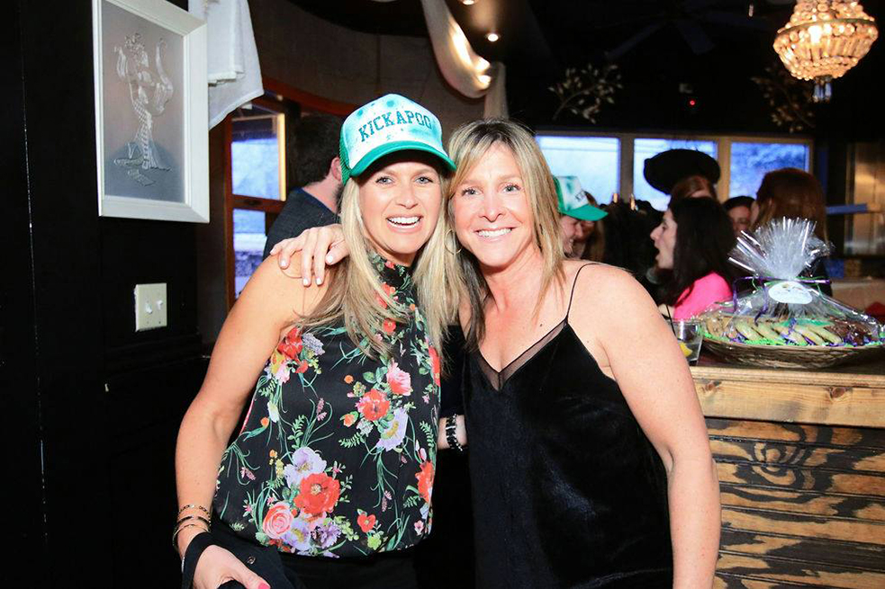 two women smiling at camera